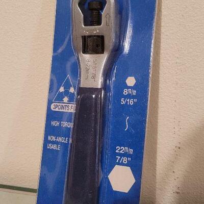 Lot 533: New Old Stock Auto Lug Wrench + 9" Uni Wrench