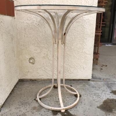 Lot 6. Iron tall outdoor glass-top iron table (36â€ x 30â€)--WAS $35â€“NOW $26.25