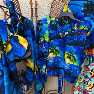 Lot 23. Twenty-two size large womenâ€™s bathing suits, two mumus, cover-up, vacation lounge wear, foldable sun hats, etc.--WAS $145â€“NOW...