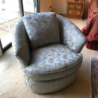 Lot 30. Upholstered light blue swivel armchair (42â€W x 36â€D x 32â€H)--WAS $85â€“NOW $63.75