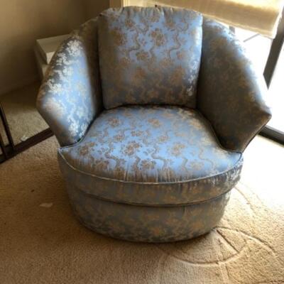 Lot 30. Upholstered light blue swivel armchair (42â€W x 36â€D x 32â€H)--WAS $85â€“NOW $63.75