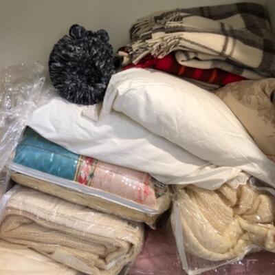 Lot 39. Assorted bedding, new queen set, new throw, 11 pillows,5 blankets, 2 flat sheets, bag of sheets and blankets--WAS $75â€“NOW $56.25