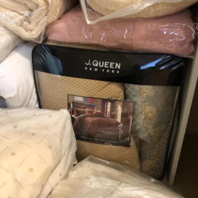 Lot 39. Assorted bedding, new queen set, new throw, 11 pillows,5 blankets, 2 flat sheets, bag of sheets and blankets--WAS $75â€“NOW $56.25