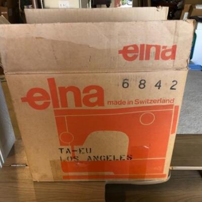 Lot 40. Elna sewing machine in original box with foot pedal and folding table--WAS $125â€“NOW $93.75