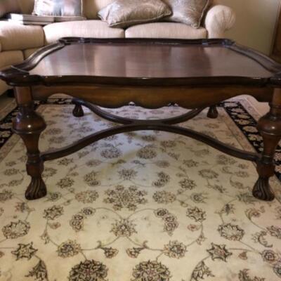 Lot 48. Wooden coffee table 42â€ square 20â€ high in walnut--WAS $65â€“NOW $48.75