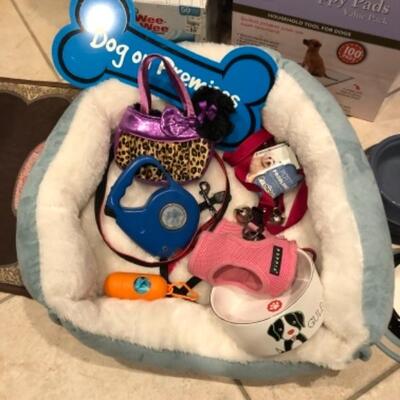 Lot 55. Dog suppliesâ€”bed, leash, harness, bowls, puppy pads, pair of dog gates, etc.--WAS $85â€“NOW $63.75