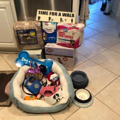 Lot 55. Dog suppliesâ€”bed, leash, harness, bowls, puppy pads, pair of dog gates, etc.--WAS $85â€“NOW $63.75
