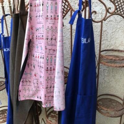 Lot 70. Eight aprons--WAS $35â€“NOW $26.25