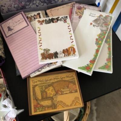 Lot 79. Lot of new notepads, boxes, gift  wrap, ribbon tags, gift  bags, Santa figure, two baskets, etc.--WAS $55â€“NOW $41.25