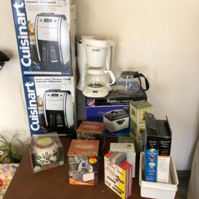 Lot 84. Two new Cuisinart coffee makers still boxed, used white Cuisinart pot, deep fryer, fountains, two dip chillers, Hawaiian mugs,...