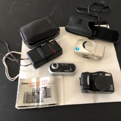 Lot 88. Four cameras, two cases and one manual--WAS $45â€“NOW $33.75