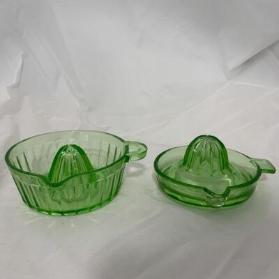 .50. Two Green Depression Glass Reamers