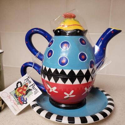 Lot 622: Colorful Teapot, Cups and Shaker