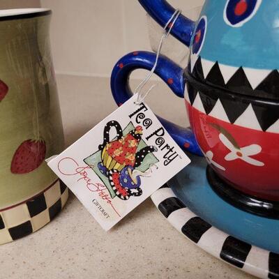 Lot 622: Colorful Teapot, Cups and Shaker