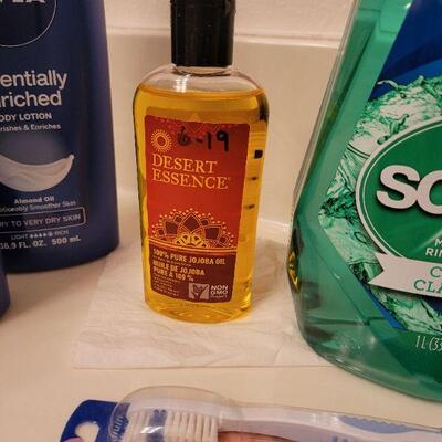 Lot 631: Soap, Lotion, Jojoba Oil, Mouthwash, Toothbrush and Pill Organizer