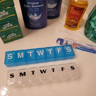Lot 631: Soap, Lotion, Jojoba Oil, Mouthwash, Toothbrush and Pill Organizer