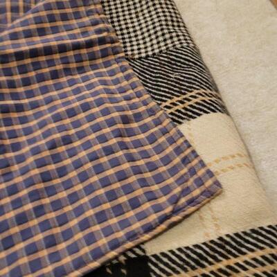 Lot 674: Vintage Wool Plaids Quilt 82" Ã— 50" (black, white & browns)