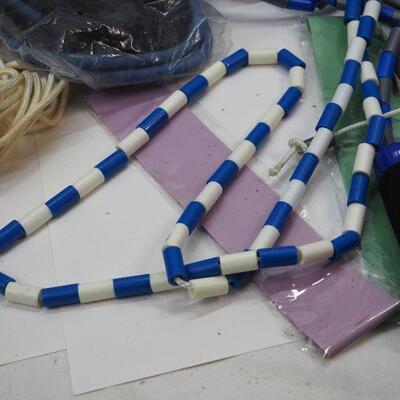 Lot 55 Bead jump ropes, therabands, sliders bands