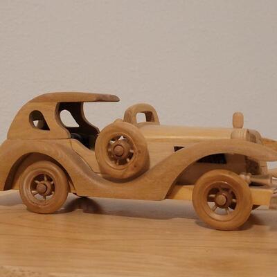 Lot 764: Wood Model Car (missing a headlight)