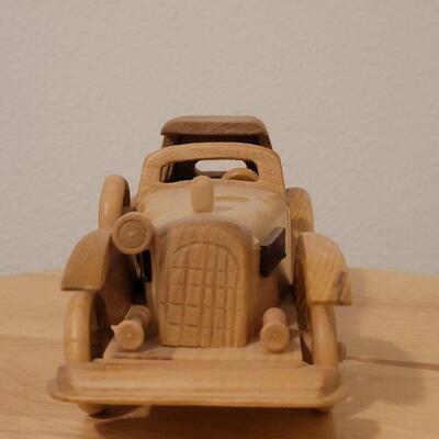 Lot 764: Wood Model Car (missing a headlight)