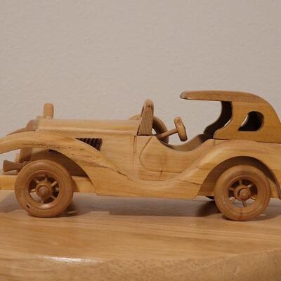 Lot 764: Wood Model Car (missing a headlight)