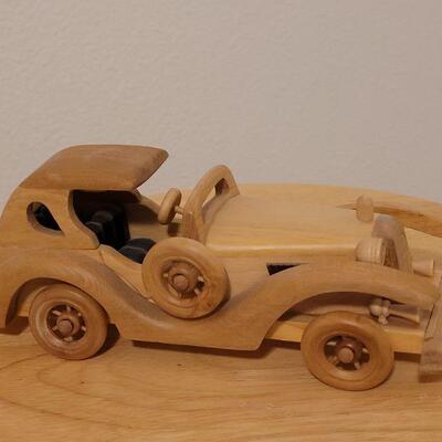 Lot 764: Wood Model Car (missing a headlight)