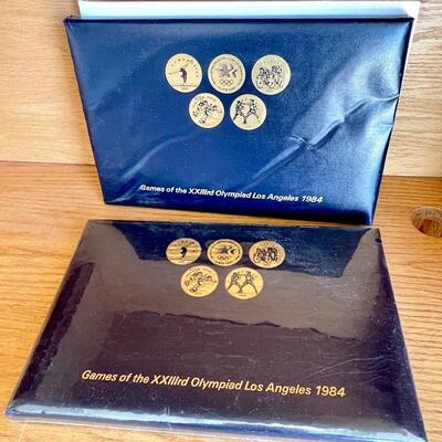 OLY 121  1984 OLYMPICS 4 TRANSIT TOKENS COIN SETS I UNOPENED 