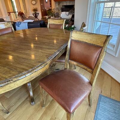 Gorgeous rustic custom kitchen table and six leather chairs