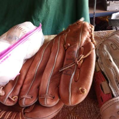 1112 - 3 Baseball Gloves, several little league and softball balls