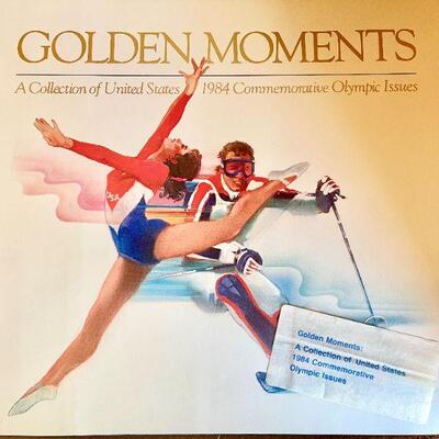 OLY 137  GOLDEN MOMENTS 1984 OLYMPICS HARD COVER BOOK PHOTOGRAPHS & TEST OF GOLD MEDAL WINNERS
