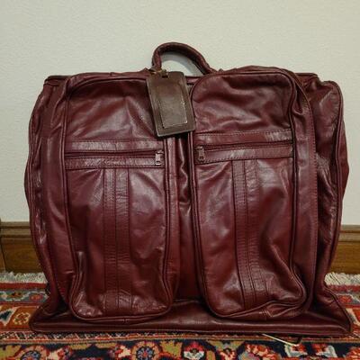 Lot 833: New Red Leather Garment Bag 