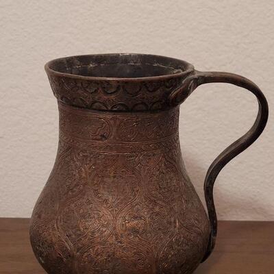 Lot 838: 19th century Middle Eastern Tinned Copper Ewer