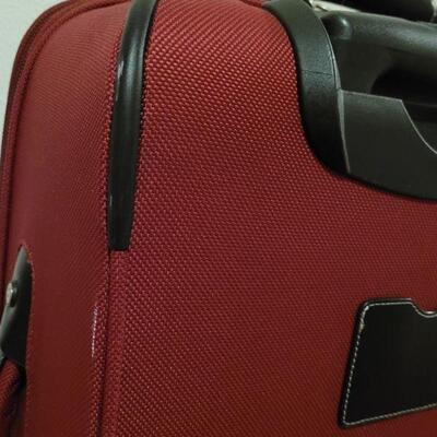 Lot 890: Omnidirectional Red Luggage 