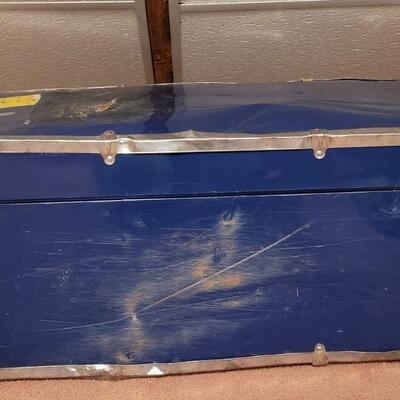 Lot 910: Vintage Blue Metal Trunk (has some damage from travel)