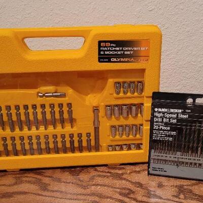 Lot 946: New High Speed Drill Bit Set and New Ratchet Driver and Socket Set (missing socket wrench)
