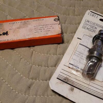 Lot 1042: Vintage New Stock OXYGEN SENSOR + Valve Stem Seals