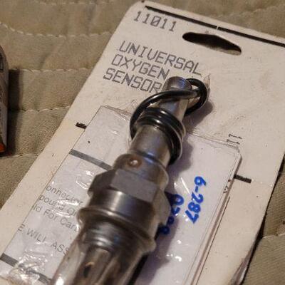 Lot 1042: Vintage New Stock OXYGEN SENSOR + Valve Stem Seals