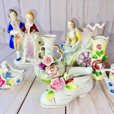 LOT 182  GROUP OF OCCUPIED JAPAN FIGURINES VASES & BASKETS ROSES
