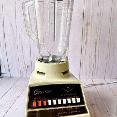 LOT 212  VINTAGE OSTERIZER BLENDER 7 OSTERIZER STORAGE JARS
