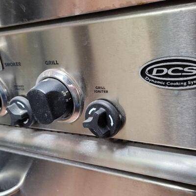 Lot 1384: DCS Grill w/ Rotisserie Feature. (GRILL HAS BEEN KEPT AND USED IN AN INDOOR GRILL ROOM SO THE CONDITION IS VERY NICE)