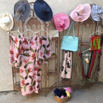 Lot 24. Large assortment of hair flowers, 6 sunhats, 2 sarongs, one strapless sun dress (Tommy Bahama), pool and beach bags, two...