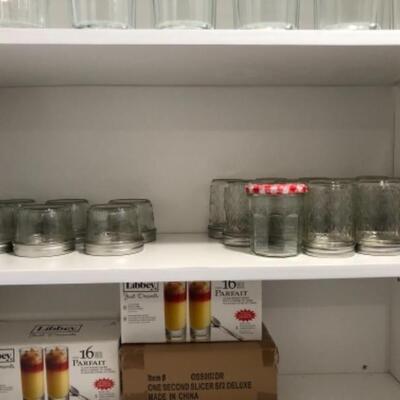 Lot 62. Plastic storage containers, water bottles, glassware, pitchers, plastic wine glasses, Ball jar funnel, Ball jars w/lids,...