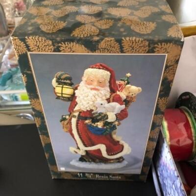 Lot 79. Lot of new notepads, boxes, gift  wrap, ribbon tags, gift  bags, Santa figure, two baskets, etc.--WAS $55â€“NOW $27.50
