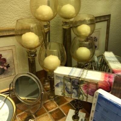 Lot 134. Tall candles, print, mirror, night light, was basket, paper towel holder--WAS $35â€“NOW $17.50