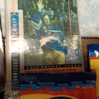 Over 25 un-opened Collectors cards/ Batman, 1990 Baseball, NHL Hockey, WWF.