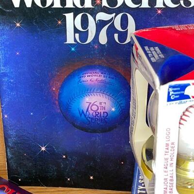 LOT 271  GROUP OF BASEBALL MAGAZINES SOUVENIR BASEBALLS WORLD SERIES PROGRAM HALL OF FAME YEARBOOKS