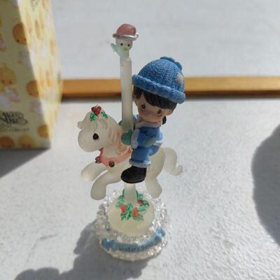 Small decorative girl on horse
