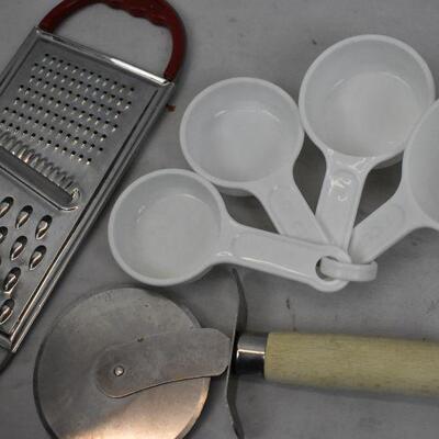 Lot of Kitchenware: Measuring cups, Silverware, Pizza Cutter, etc.