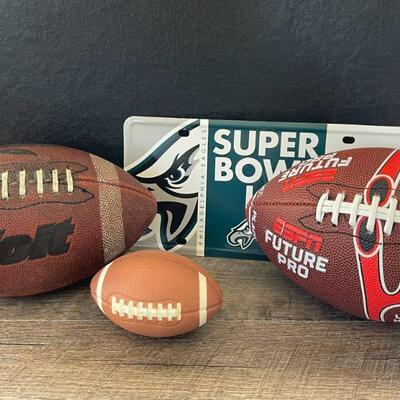 12: 2 Footballs and a Superbowl Sign