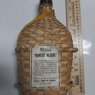 Vintage tequila bottle woven